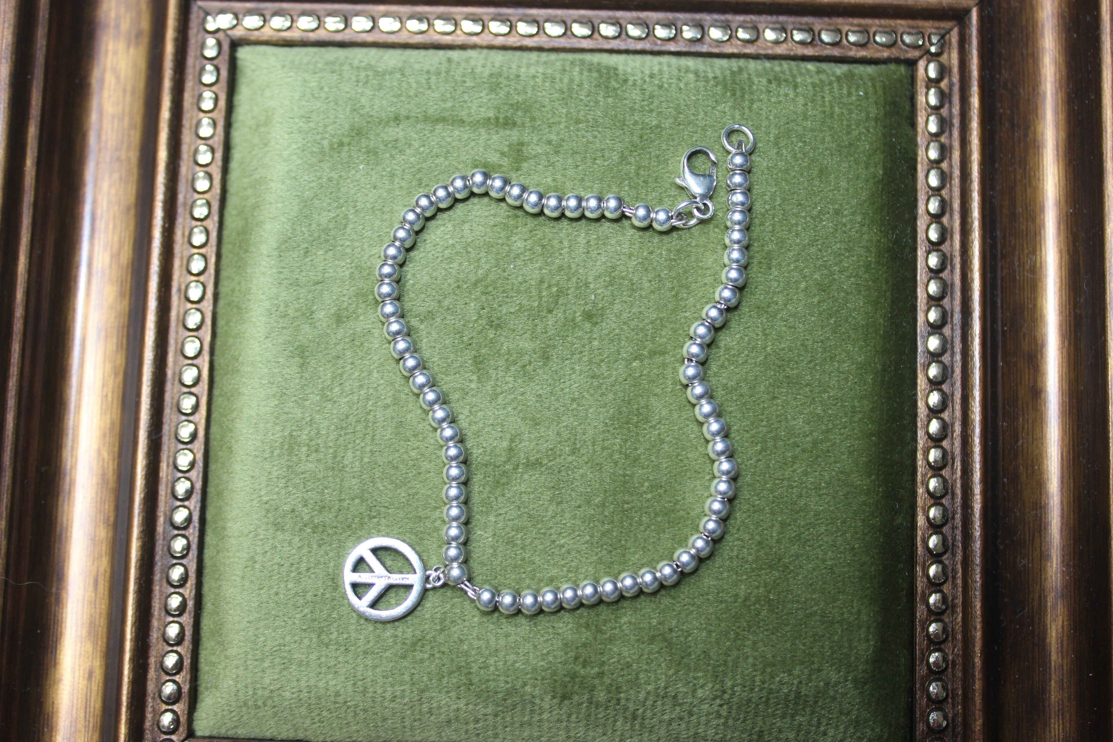 Vintage Tiffany & Co. Sterling Silver Bead Bracelet with Peace Sign Charm
