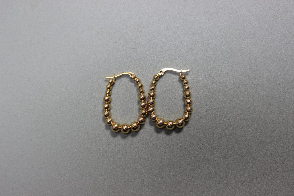 U-Shaped Gold Beaded Hoop Earrings (close-up) – The Nook